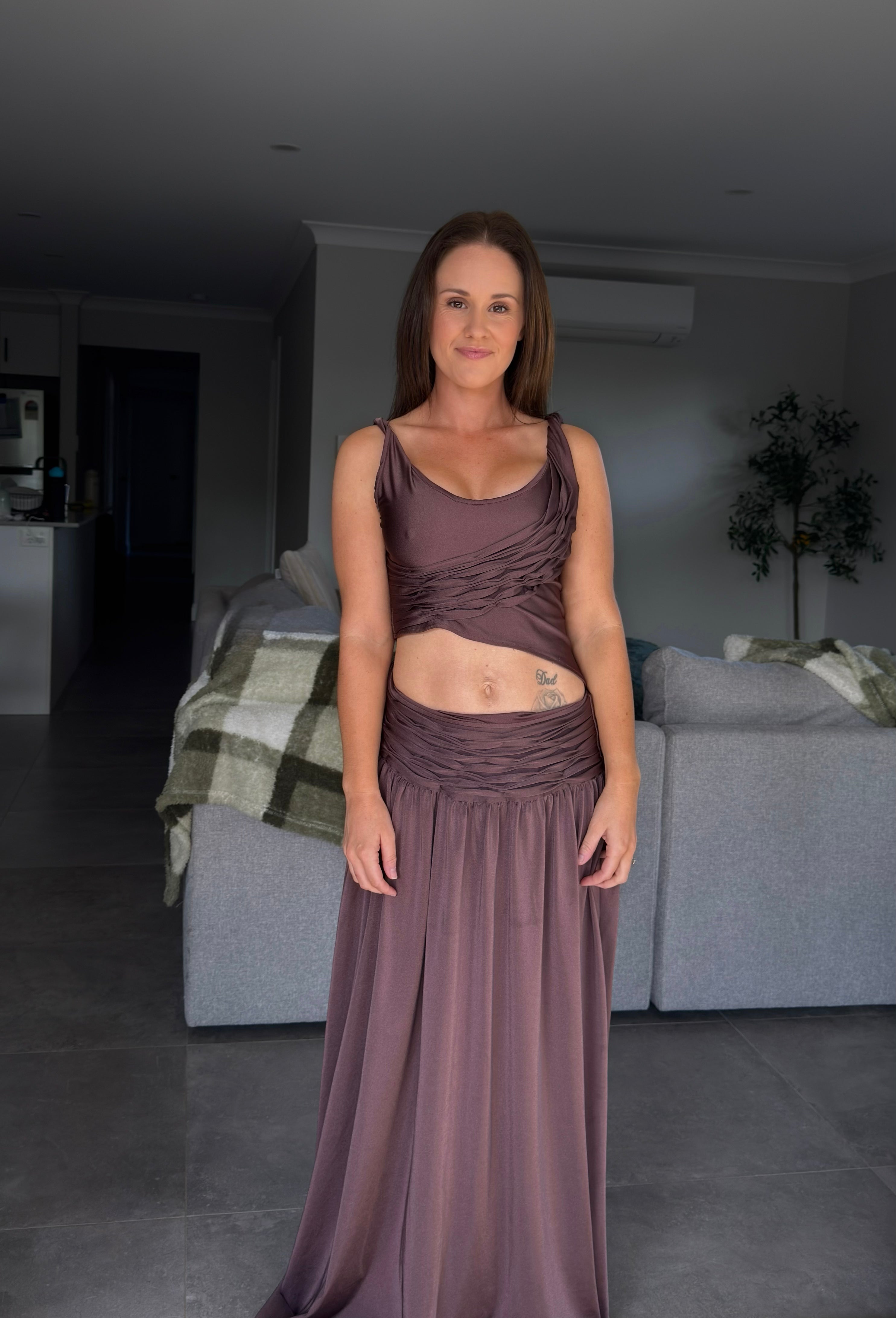 Women in a brown set standing in the loungeroom. - @samanthaleebetts