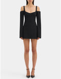 Black off-shoulder dress worn by a model on a white background