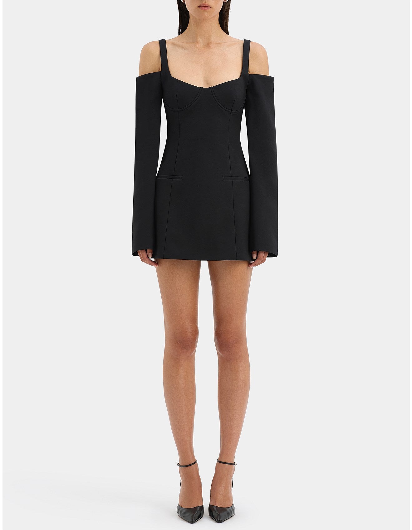 Black off-shoulder dress worn by a model on a white background
