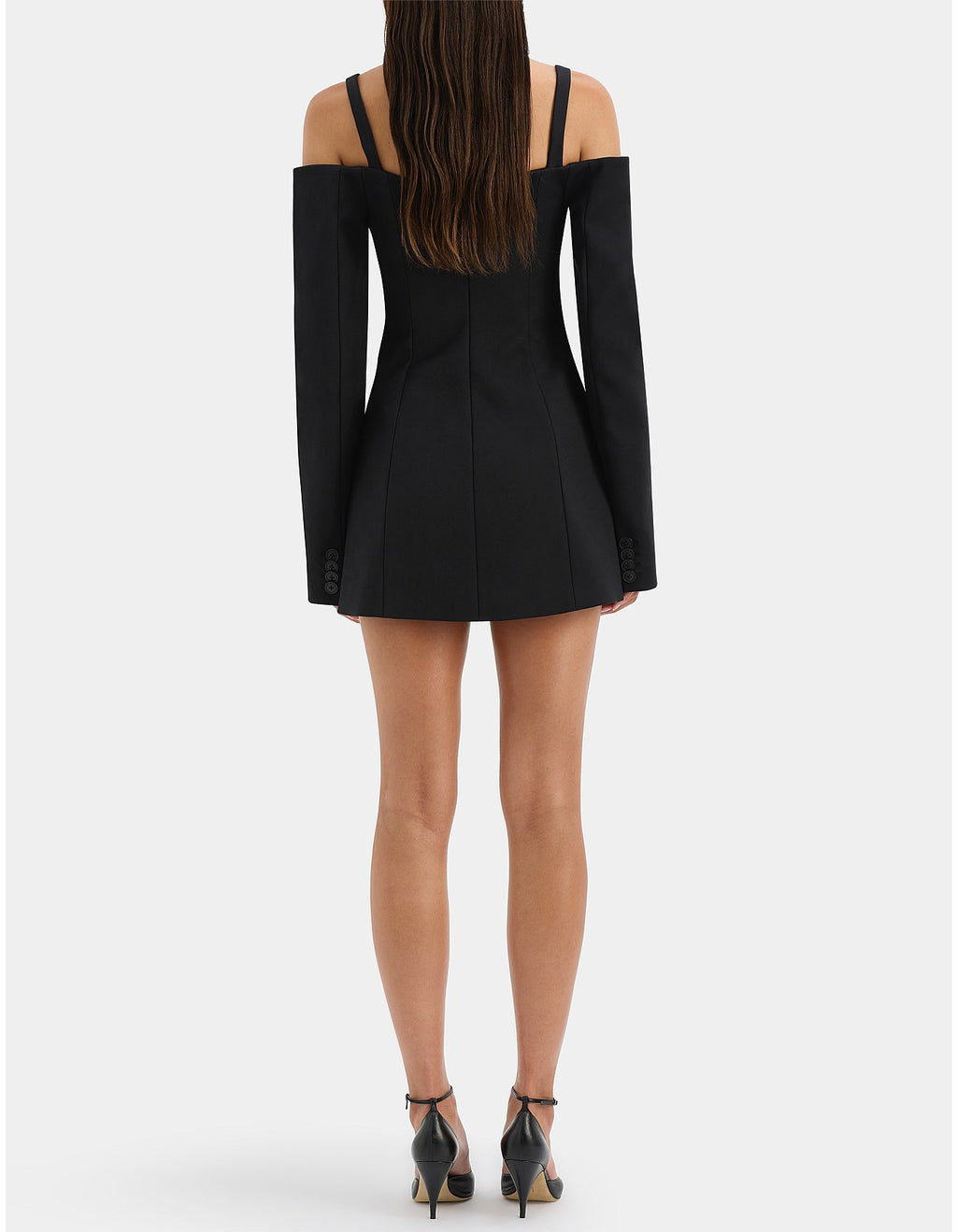 Black off-shoulder dress worn by a person on a white background