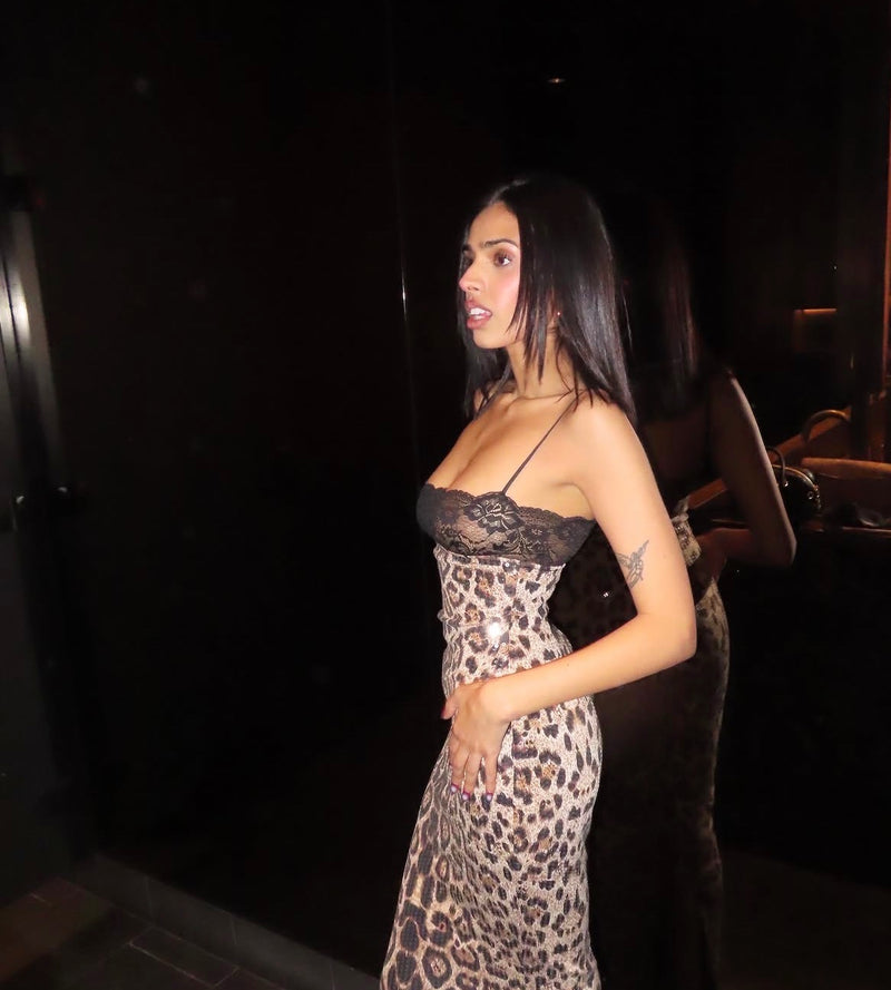 Girl standing in a mirro background in a cheetah dress. - @nandipaul_