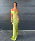 Woman in a bright yellow off-shoulder gown against a dark background - @chelseabalzan_