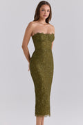 Woman wearing the House of CB Alexia Midi Dress in olive, featuring metallic floral lace, a strapless corset-style bodice and fitted midi silhouette in front of a white backdrop.