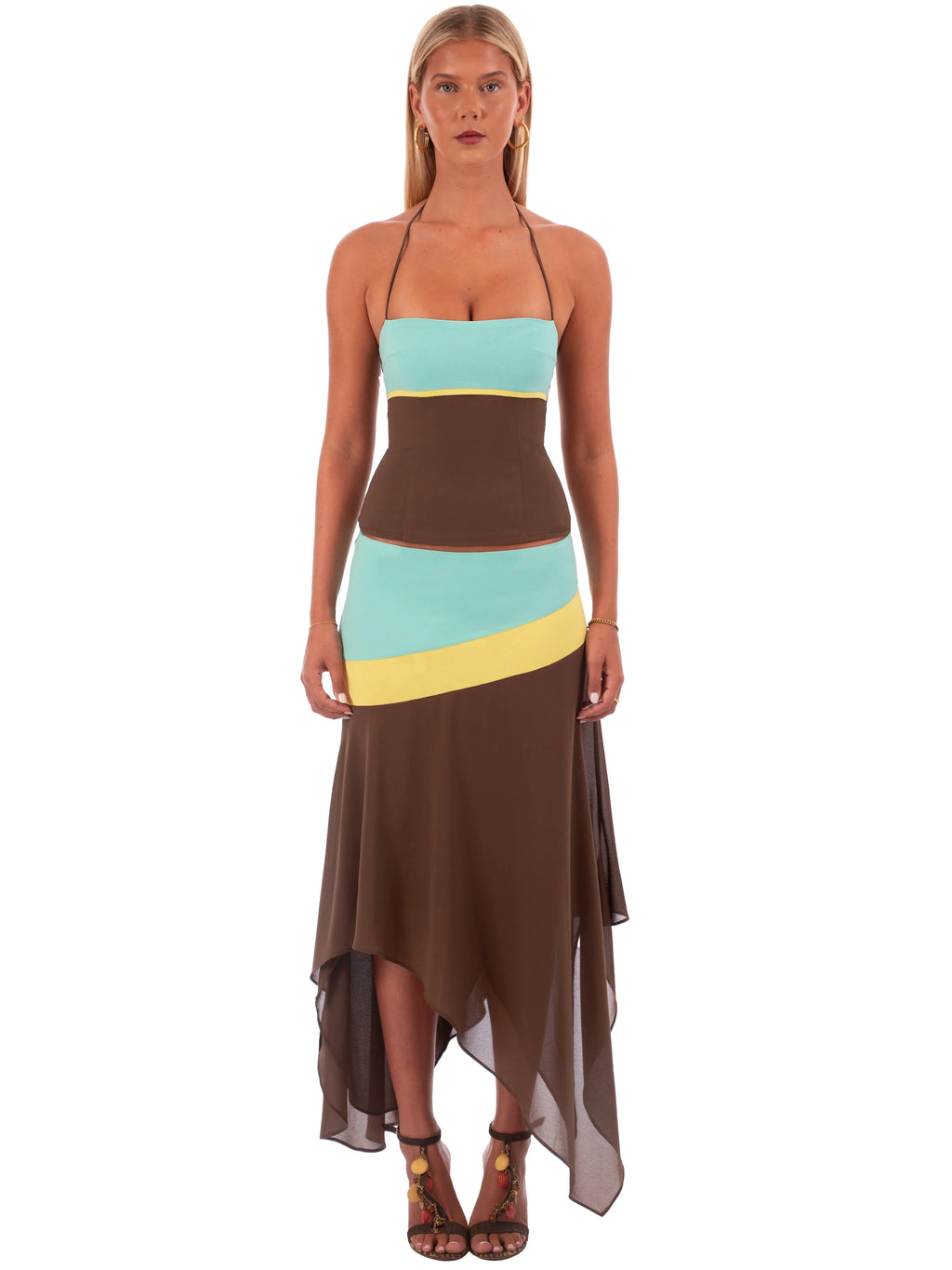 Woman wearing a multicolored dress with a white background
